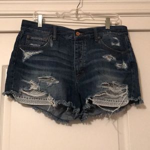 Ripped and patterned high waisted shorts